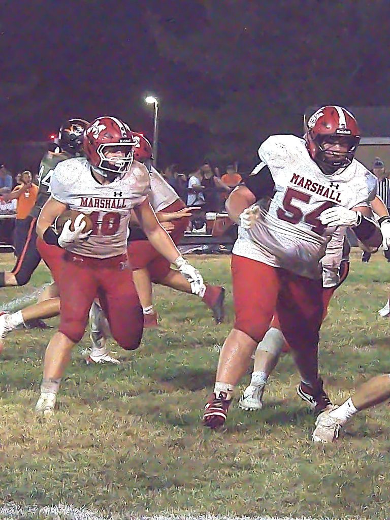 Boston Rollings (54) leads Lucca Giannavola (40) around the corner. Photo by T Ray Henry.
