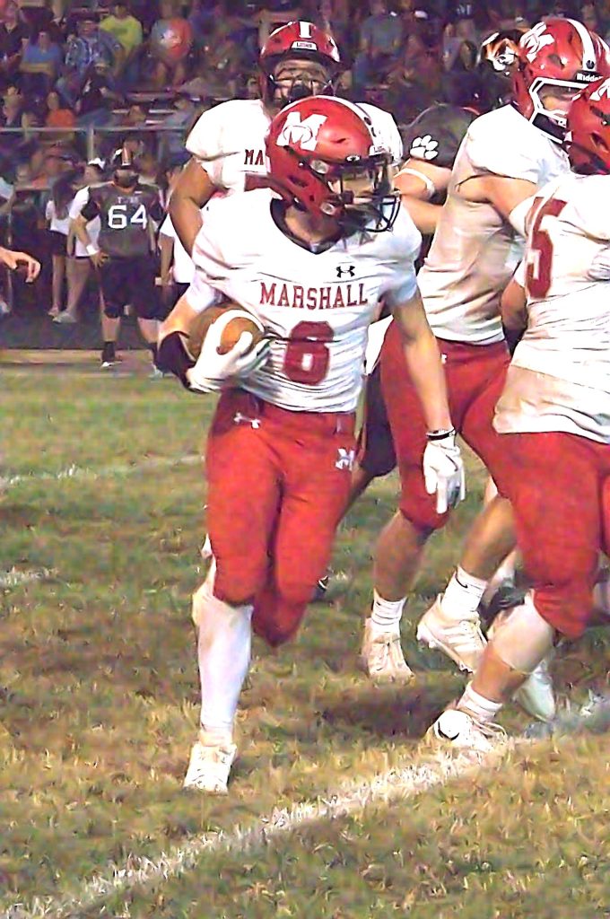 Silas Dean (6) breaks open through the right right side against Olney. Photo by T Ray Henry.