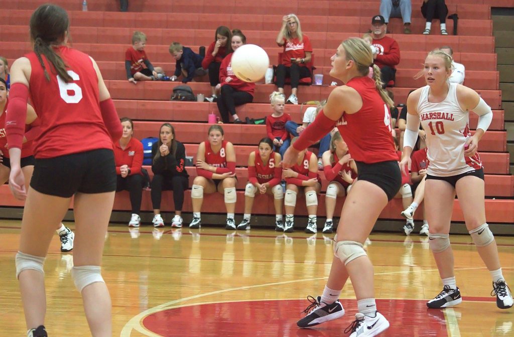 Anna Daugherty (4) returns a serve during Marshall's three-set match vs Newton. Photo by T Ray Henry.