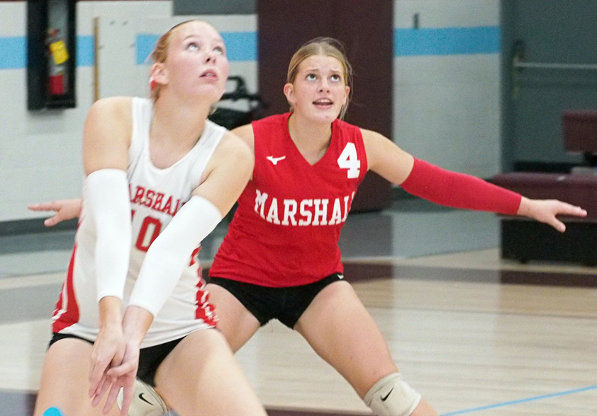 Avery Cornwell (10) gets ready to pass as Anna Daughterty (4) looks on.