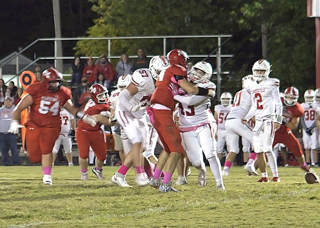 Bryer Jansen strips the ball from the Lawrenceville ball carrier