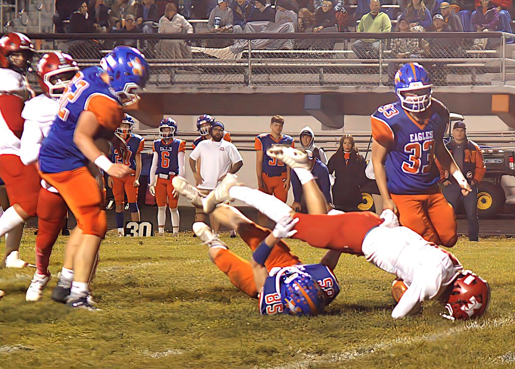 Liam Keim steamrolls a Newton defender on the way to a first down for Marshall
