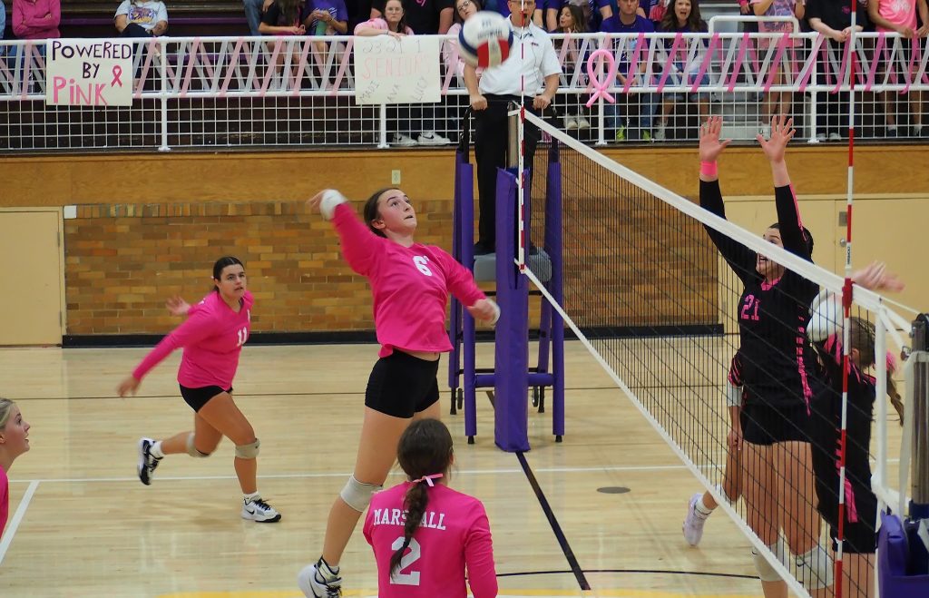 Lilly Ross (6) lines up to smash a kill through the Casey-Westfield block during Marshall's big win.